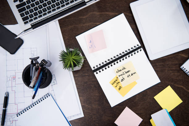 istock flat lay with laptop, notepads, sticky notes and office supplies on wooden tabletop at workspace 694454878