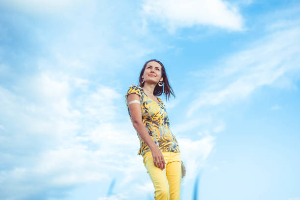 istock Woman in pants sky 694458026