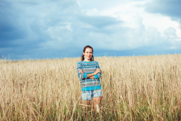 istock A woman in a rye field 694458230