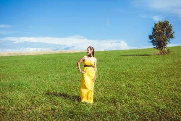 istock girl on a green meadow 694458522