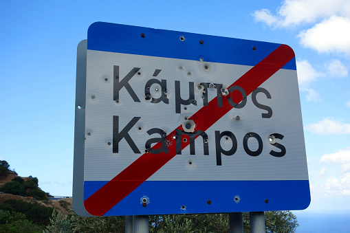In Western Crete almost all the road sign are full of bullet holes. This one has been shot with Shotgun, Rifle and Pistol, Kampos, Crete, Greece