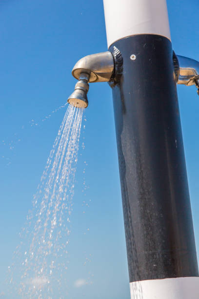 istock Water flowing from public shower on the beach 694461940