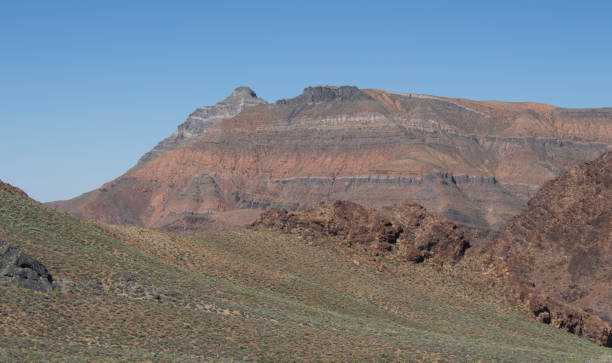 istock Road through desert and mountains 694462400