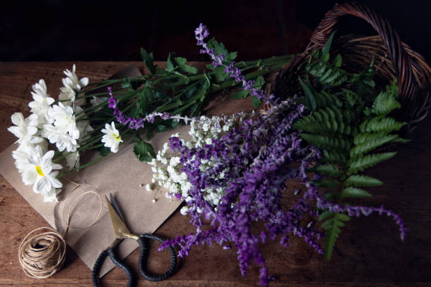 istock Bunch of flowers picked from garden on a table 694465746