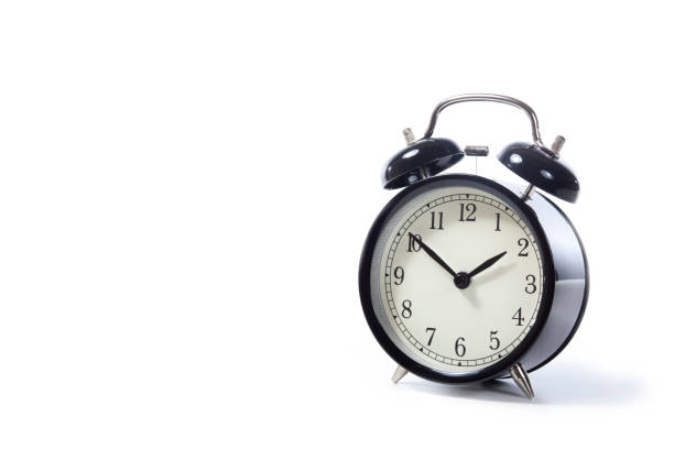istock Black metal retro style alarm clock with bells 694474398