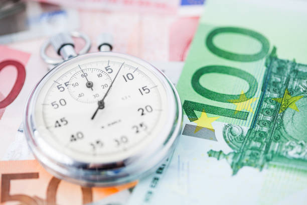 stopwatch on euro notes concept shot stopwatches can start or stop the time