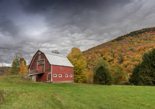istock Beautiful barn on a stormy day 694482420