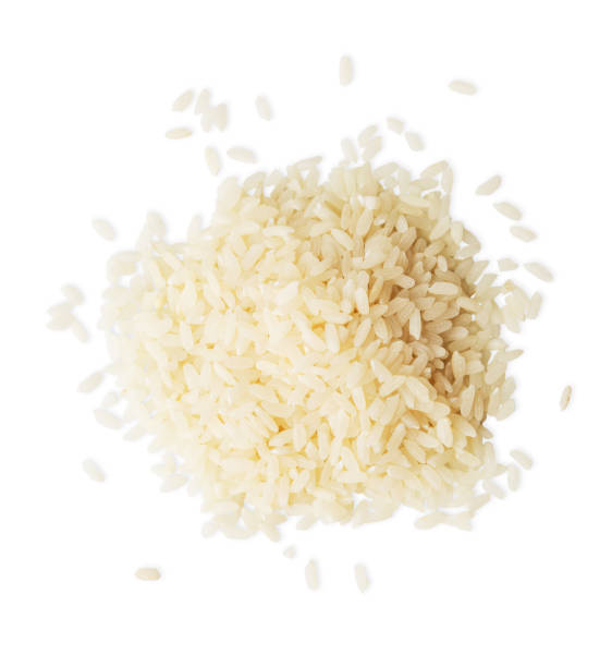 istock Pile of rice top view isolated on white background 694485228