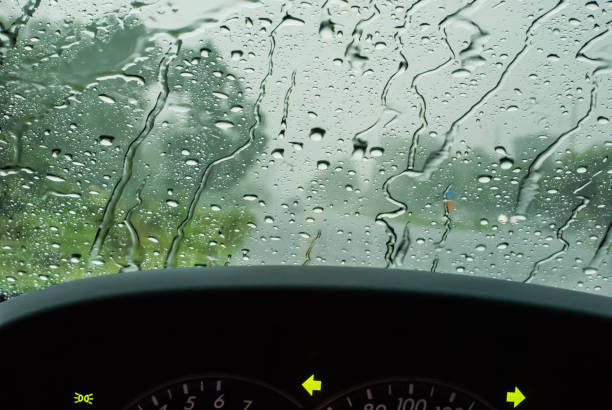 istock Heavy rain, blurry auto glass. traffic jam 694485626
