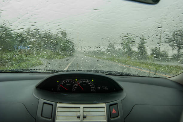 istock Heavy rain, blurry auto glass. traffic jam 694485630