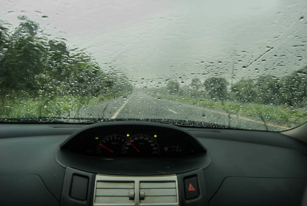 istock Heavy rain, blurry auto glass. traffic jam 694485632