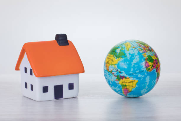 istock Global warming concept with an eco house 694489420