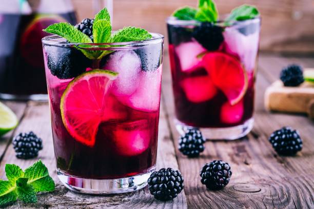 istock Blackberry mojito  cocktail  with lime, and mint 694491936