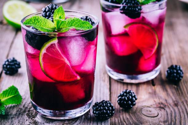 istock Blackberry smash  cocktail  with lime, and mint 694491954