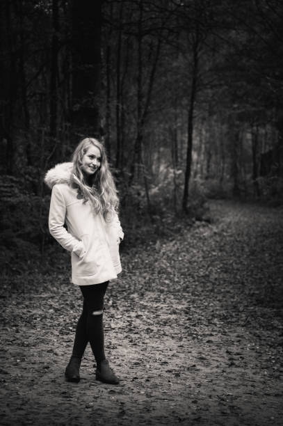 istock Young blonde woman in woods 694507046
