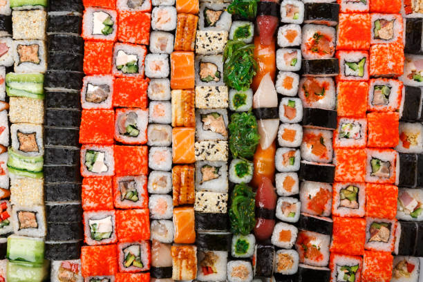 istock Set of sushi, maki and rolls background 694507590