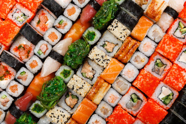 istock Set of sushi, maki and rolls isolated on white background 694507612