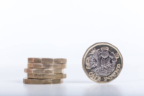 istock Stack of the new British one pound coins 694508992