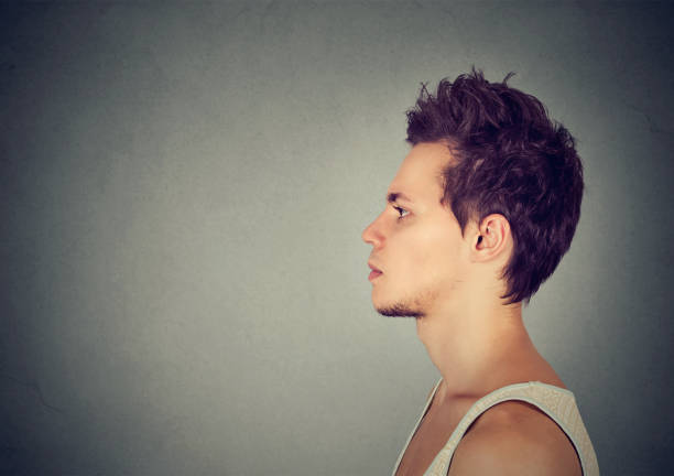 istock Side profile of a serious young man 694511656