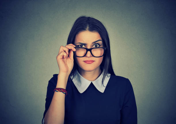 istock Skeptical jealous woman looking at camera 694511748