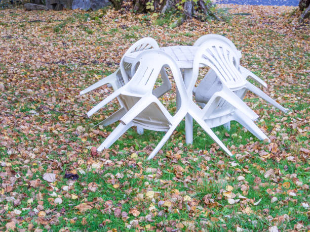 istock Plastic chair and table in the park 694512344