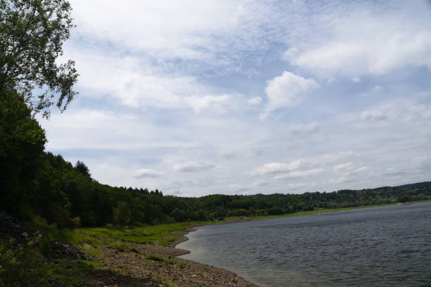 istock Sky with veil clouds over lake shores 694512988