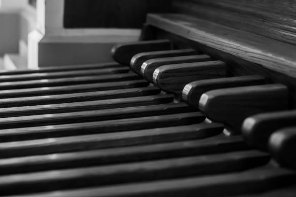 Church organ pedals as a background, black and white