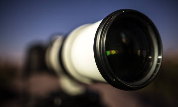 istock Professional camera under the light of the moon at night 694526110