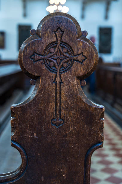 istock Cross carved on a wooden bench in Berlin, Germany 694529280
