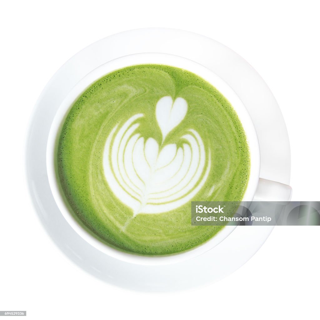Hot green tea matcha latte cup with beautiful milk foam latte art on top isolated on white background, clipping path included. Latte Stock Photo