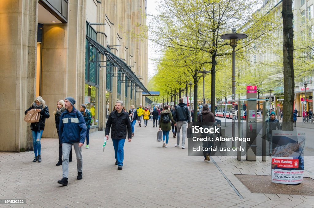 People Strolling around Mönckebergstrasse in Hamburg City Centre Hamburg, Germany - May 5, 2017:  People walking on a Pavement Along Mönckebergstrasse on a Spring Day. Mönckebergstrasse is probably the best-known and most used and visited shopping street in Hamburg Hamburg - Germany Stock Photo