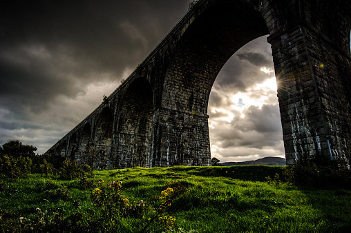 By a cloudy and rainy afternoon in a short instant the Sun succeeded to unfold its Light on the land under the Viaduct, Newry, County Down, Northern Ireland, United Kingdom