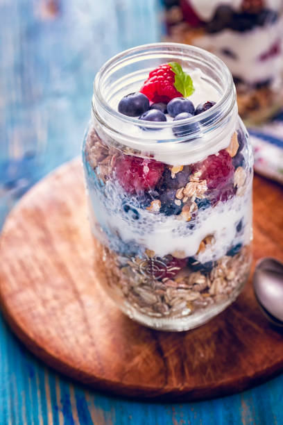 istock Yogurt with Fresh Berries and Cereals 694542896