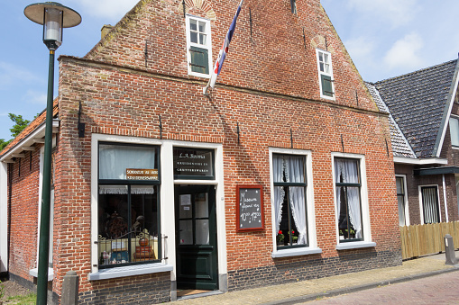EXMORRA, NETHERLANDS, June 27, 2015: Ancient Dutch grocery in the small village Exmora in Friesland in the Netherlands
