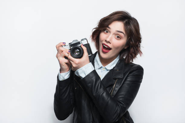 istock Pretty girl with camera 694553490