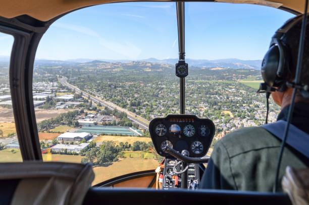 istock Helicopter flying town in Napa Valley, California 694556348
