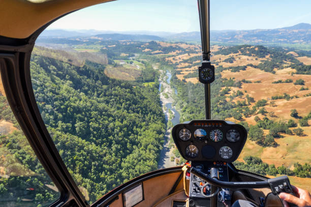 istock Helicopter flying over river in Napa Valley, California 694556544