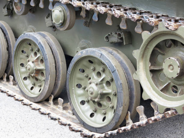 istock Green tracks of russian tank closeup view from front 694569512