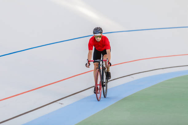 istock Racing cyclist on velodrome outdoor 694584980
