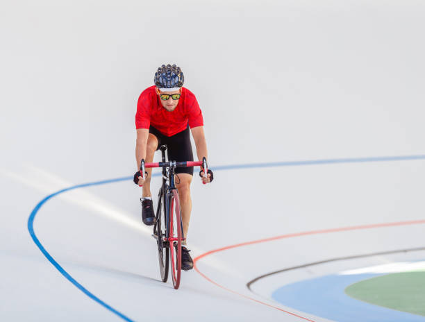 istock Racing cyclist on velodrome outdoor 694585264