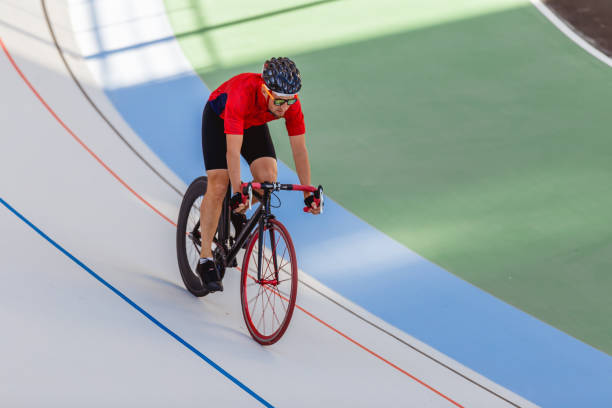 istock Racing cyclist on velodrome outdoor 694585294