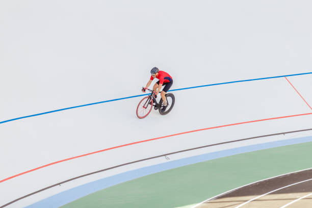 istock Active man on white velodrome outdoor 694585312