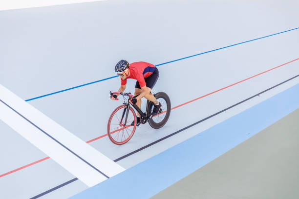 istock Cyclist finishes on velodrome 694585452
