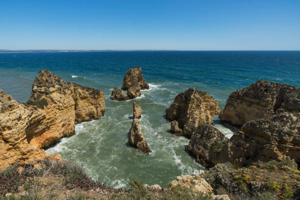 istock Rocks and waves on the seashore 694588192