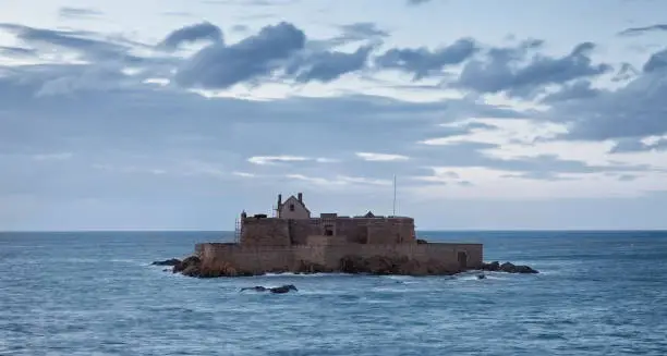 Dusk image of The Fort National from Saint Malo,in Brittany in northwestern France, during the high tide time.