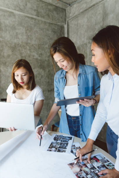 istock Female coworkers discussing a project in a new office space 694619870