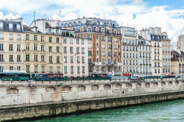 istock Paris street scene and architecture along the Seine River 694619990