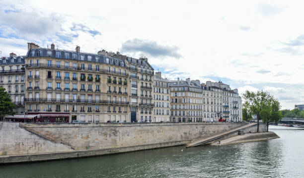 istock Paris street scene and architecture along the Seine River 694620052