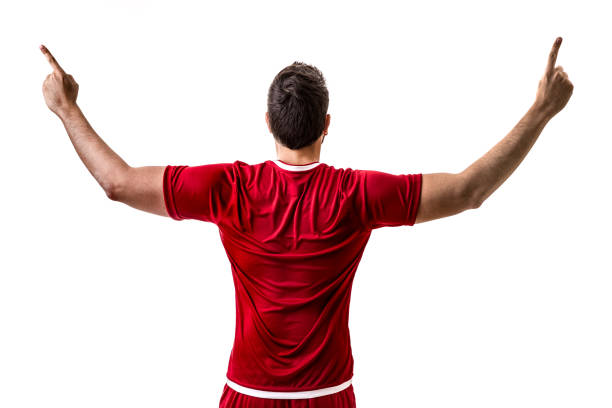 istock Fan / Sport Player on red uniform celebrating on white background 694620366