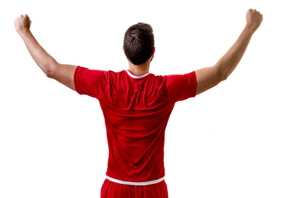 istock Fan / Sport Player on red uniform celebrating on white background 694620382